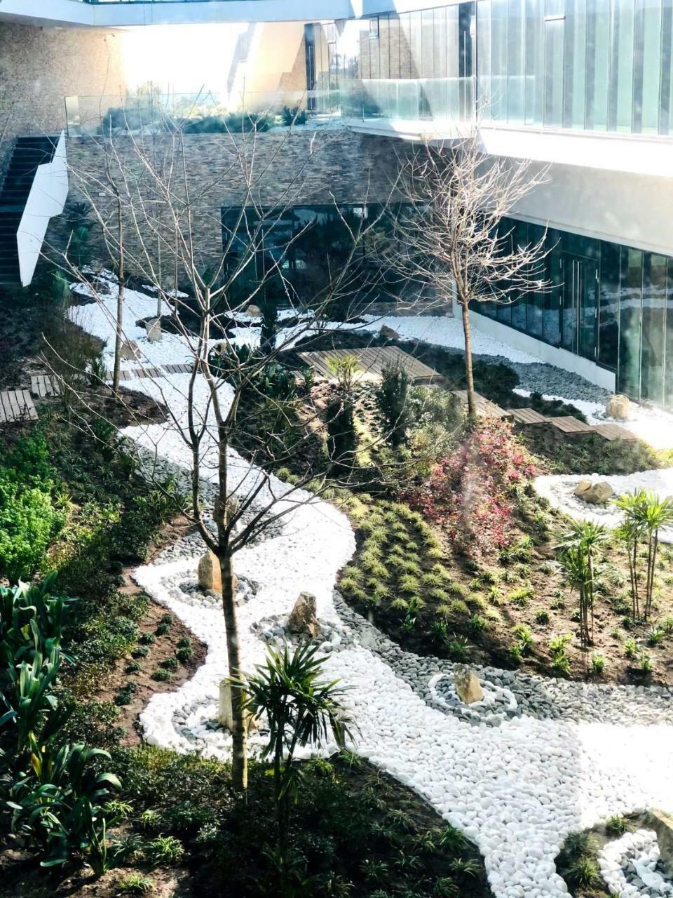 Royal Obidos Scenic Resort Praia del Rei Exterior photo The waterfall at the entrance of the building